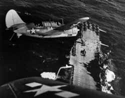 Two SBC2C-3 over USS Hornet (CV-12).jpg