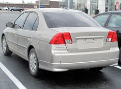 2004 Honda Civic DX in Shoreline Mist Metallic, Rear Left, 05-29-2022.jpg