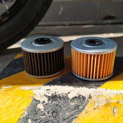 Motorcycle oil filters on Kawasaki W175. Old (left) and new (right).
