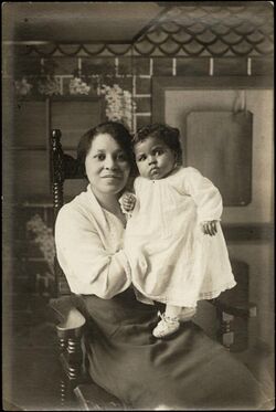 Portrait of a woman holding a baby (I0024828).jpg