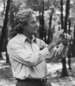 Feynman standing among trees