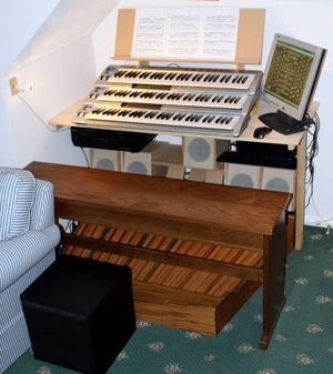 A picture of a Hauptwerk console in a domestic setting