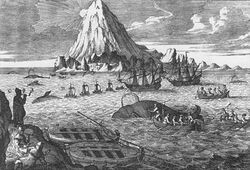 Two whaleboats beached in foreground, five rowed and four sailing whaleboats chasing/attacking five whales, two larger whaling ships nearby, and sun peeking around snow-covered mountain in background