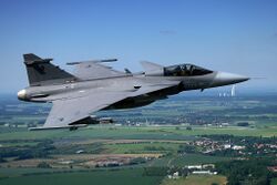 Air-to-air with a Czech Saab Gripen with AFB Čáslav in the background.jpg
