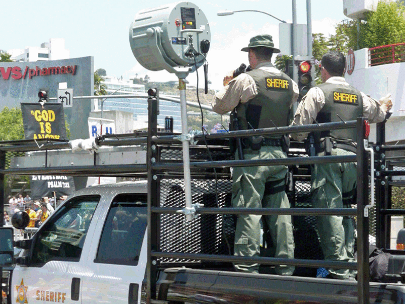 File:HS-16 at LA protest with sheriffs copy.gif