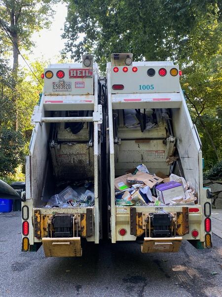 File:Split body rear loading waste collection truck.jpg
