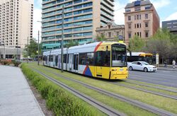 Adelaide tram at Victoria Square (21122460463).jpg