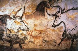 Aurochs, horses and deer painted on a cave wall
