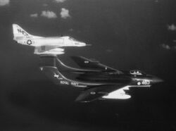 Sea Vixen of 893 NAS and VA-55 A-4E in flight 1964.jpg