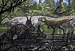Restoration of various dinosaurs chasing in a watery area
