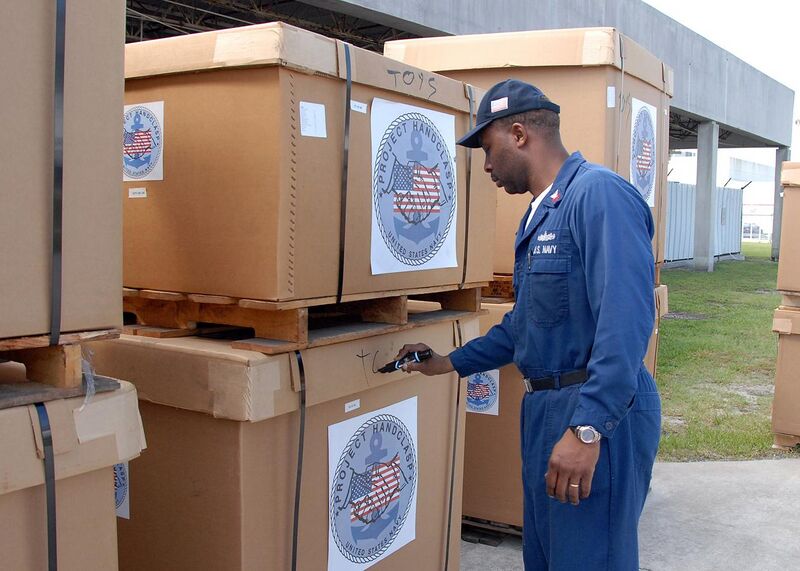 File:US Navy 080811-N-2821G-133 Culinary Specialist 2nd Class Paul Thomas, assigned to Commander, Task Force (CTF) 43, labels a box of Project Handclasp humanitarian aid supplies before storing it in the CTF-43 warehouse.jpg