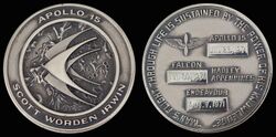Apollo 15 mission emblem and crew names (front). Dates (launch, lunar landing, and return) and landing site (back)