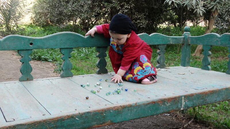 File:Playing with glass marbles.jpg