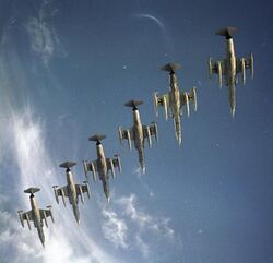 Six F-104Gs flying in formation photographed from below