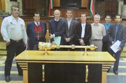 Designer Grant Schreiber reviews the old Parliamentary Mace with a team from the South African Parliament, 2004.jpg