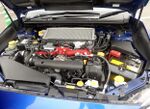 Open engine compartment of a Subaru WRX STI for the Japanese market, showing the horizontally-opposed "boxer" engine coded "EJ207"
