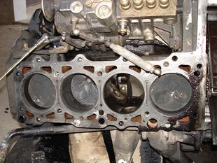 Mercedes-Benz OM601 Diesel Engine pistons top view (engine head removed).JPG