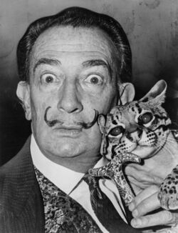 Salvador Dalí with his pet ocelot, Babou, 1965