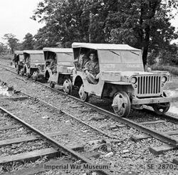Road-rail Jeeps between Myitkyina and Mogaung, Burma, December 1944 (IWM SE 002870).jpg