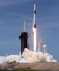 Ground-level view of a Falcon 9 lifting off from its launch pad