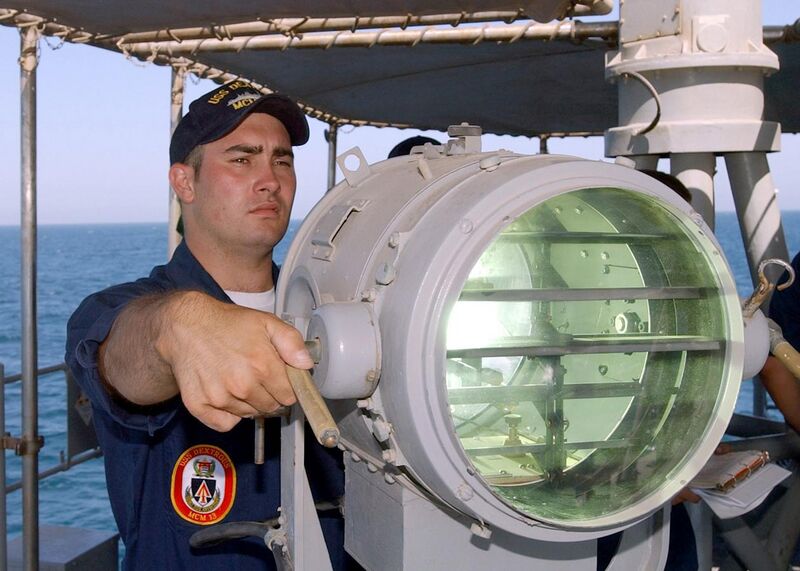 File:US Navy 020623-N-5329L-007 Signalman 2nd Class Eric Palmer signals the U.S. Navy mine hunter coastal ship USS Raven (MHC 61.jpg