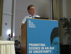 photo of Chris French presenting from podium at the World Skeptics Congress 2012 in Berlin