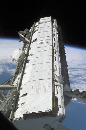 S112 S1 truss is moved from the Payload Bay of Atlantis.jpg