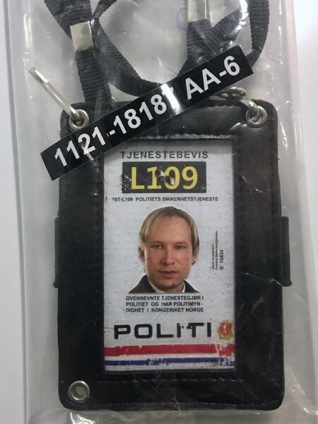 File:Terrorist Anders Behring Breivik's fake police ID as evidence item on display at 22. juli-senteret (22 July Information Center) in Regjeringskvartalet, Oslo, Norway. Photo 2018-09-14.jpg
