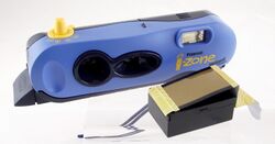 Polaroid i-Zone instant camera and film cartridge.jpg