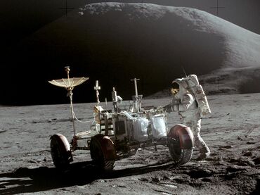 Astronaut works on the Moon at the lunar rover