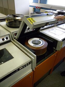Disk drive of professional large computer system (1970s) with removable disk pack as storage medium inside, from 'International Computers Limited'.jpg