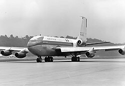 This photo depicts the Boeing 367-80 N70700 with a fifth engine on the aft fuselage, attached during testing for the Boeing 727. The engine is mounted on the side instead of under the tail like the 727.