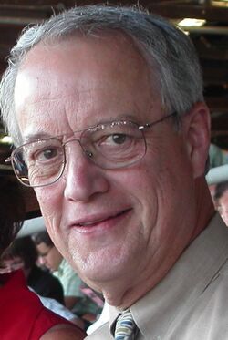 head shot of smiling man in his sixties