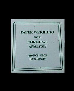 Weighing paper in lab.jpg