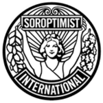 A circular, black and white logo with a style suggesting late Art Nouveau or early Art Deco. Soroptimist International describes it as follows: "The emblem consists of a circular disc on which the figure of a woman holds the banner 'Soroptimist' in uplifted arms, spreading sunrays from the background. [From] the banner on one side fall acorns and leaves of oak and on the other side, leaves of laurel. [The] word 'International' completes the outer circle."[1]