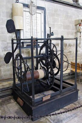 The mediaeval clock appears as a group of cogs and wheels, large and small.