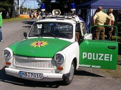 Green-and-white police car