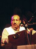 Musician Ustad Farrukh Fateh Ali Khan Saheb with a harmonium