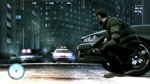 The player character positioned in cover behind a vehicle, preparing to shoot at police officers on the other side of the vehicle.