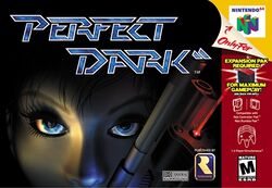 The face of a woman holding a gun occupies a black background while a grey alien is reflected on her right eye. At the top of the image, the title "Perfect Dark" is displayed with a double slash symbol after the word "Dark". Game specifications are shown on the right side of the image.