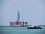 Semi submersible drilling rig, Stena Clyde, and Australian Customs, Cape St George, on Darwin Harbour.jpg