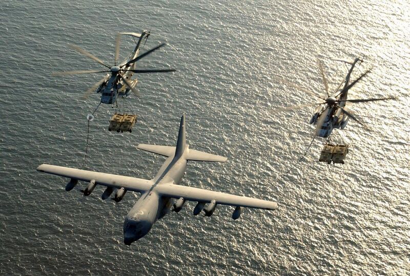 File:US Navy 030130-M-0000X-001 Two U.S. Marine Corps CH-53E Super Stallion helicopters assigned to Marine Heavy Helicopter Squadron-772 (HMM-772) receive fuel from a KC-130 Hercules.jpg