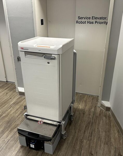 File:Hospital delivery robot having priority to elevators.jpg