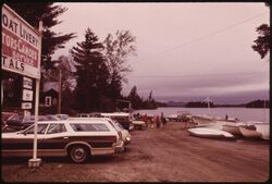 PRIVATE BOAT LIVERY AT RAQUETTE LAKE, NEW YORK, IN THE ADIRONDACK FOREST PRESERVE, ON MEMORIAL DAY WEEKEND, AT THE... - NARA - 554484.jpg