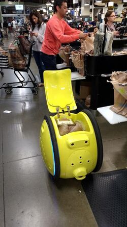An early prototype Gita robot being packed with groceries at a Boston area supermarket.