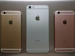 Reverse of three iPhones, showing the Apple logo