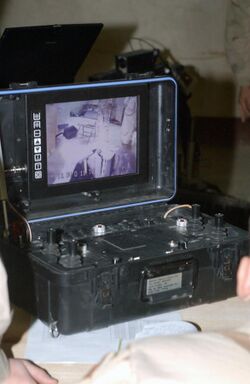 The computerized switch device used to control the Mesa Associates' Tactical Integrated Light-Force Deployment Assembly (MATILDA), during a training session at Bagram Airbase, durin - DPLA - 9143fdb19c2f6ade7f7ac8dc3ca8b71d.jpeg