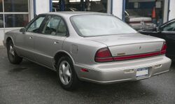 1996 Oldsmobile LSS (champagne), rear left.jpg