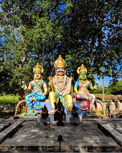 Dravidian - Tamil Folk Deity Aiyanar with his wives.jpg