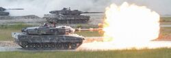 German Leopard 2A6 from 3rd Panzer Battalion fires it's main gun during the shoot-off of Strong Europe Tank Challenge (40964003420) (cropped).jpg